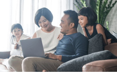 Family looking at laptop